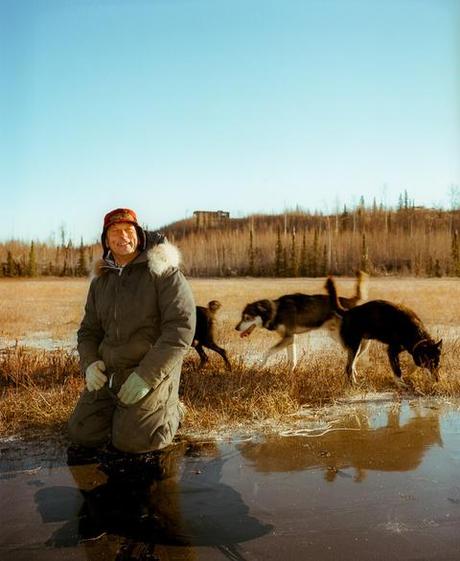 Alaska homeowner with dogs by Kamil Bialous