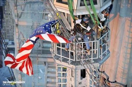 “Ironworkers courageously guide spire sections 17 and 18 into place.”