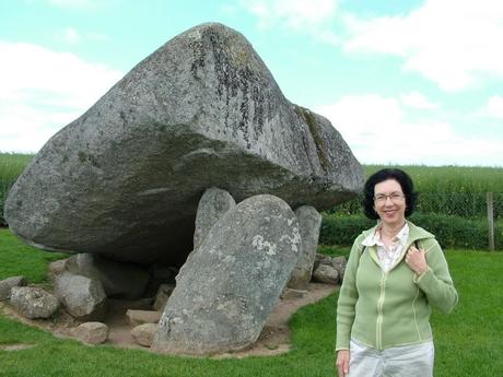 jean stands in front of the brownshill portal tomb -  county carlow - ireland