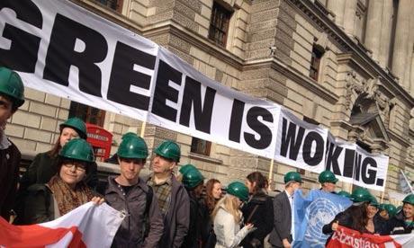 Activists from Stop Climate Chaos Coalition protest in front of the Treasury for green jobs