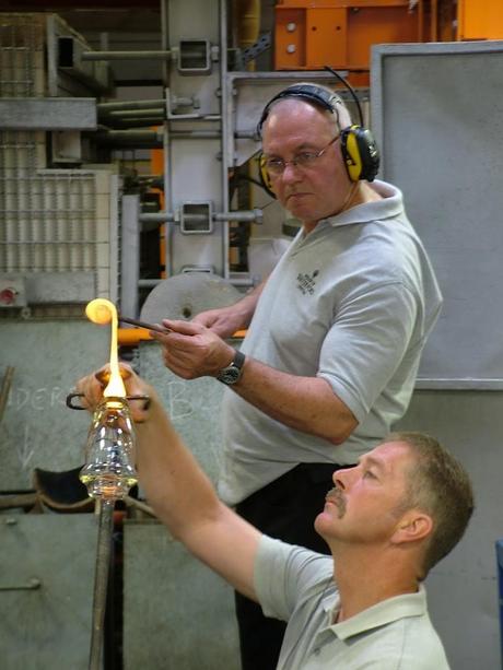 glass blowers work molten glass vase base - house of waterford crystal - waterford - ireland