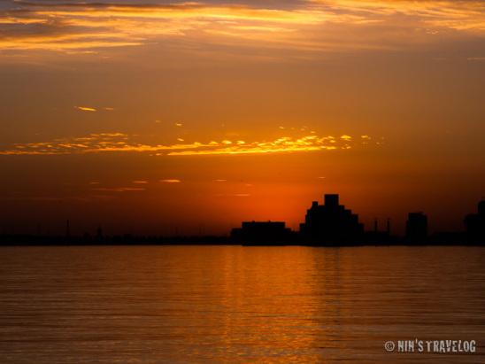 Sunrise in Doha, where the sun was just behind that building... or this is only a few seconds before sunrise?