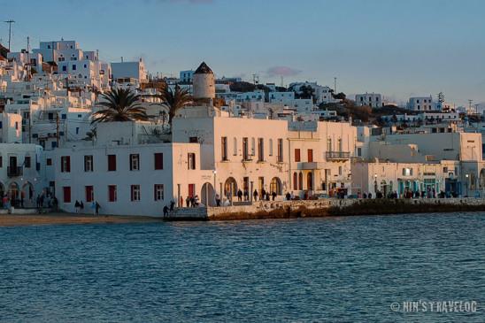 An hour before sunset at Mykonos, where the sunlight touches the white painted buildings and created a warm color on the buildig