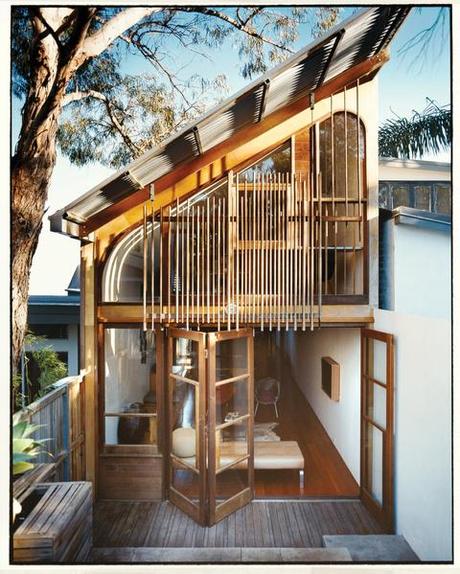 Façade with custom cedar windows and wooden dowels