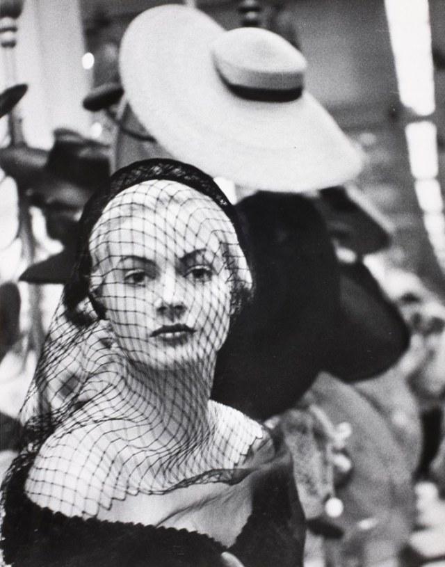 Lisa Larsen, [Miss Sweden Anita Ekberg sporting a veiled hat by Mr. John during her hat-buying spree while visiting the United States for possible work as model], 1951