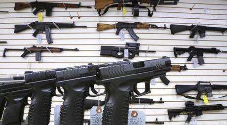 In this Jan. 16, 2013 file photo, assault weapons and hand guns are seen for sale at Capitol City Arms Supply in Springfield, Ill. The deadline for local governments in Illinois to enact assault weapons ordinances is Friday, July 19, 2013.