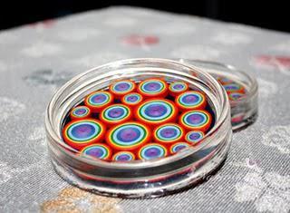 Beautiful coasters with paper quilling in colors of rainbow