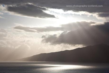Photo - late afternoon sun bursting out from behind the clouds over Loch Linnhe, Scottish Highlands