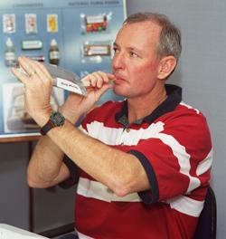 Astronaut Brian Duffy, STS-92 mission commander, samples a beverage during a crew food evaluation session in the food laboratory at the Engineering and Applications Development Laboratory at the Johnson Space Center (JSC).