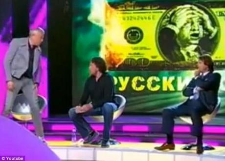 Russian oligarch Alexander Lebedev punches rival on TV, tears tight jeans