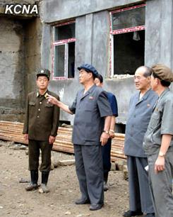 DPRK Cabinet Premier Pak Pong Ju (2nd L) tours the construction of apartments which upon completion will house DPRK scientists (Photo: KCNA).