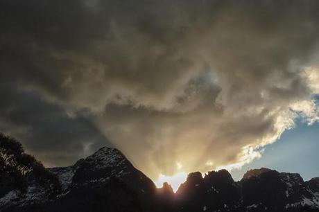 sun shining behind mountain overland track