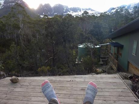 sitting outside bert nichols hut overland track