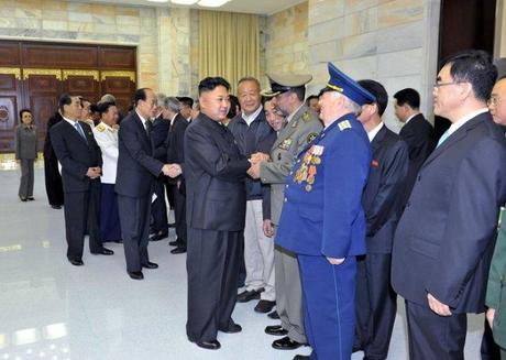 Kim Jong Un shakes hands with the heads of foreign military delegations on 26 July 2013.  Seen in the background, L, is his aunt KWP Secretary Kim Kyong Hui (Photo: Rodong Sinmun).