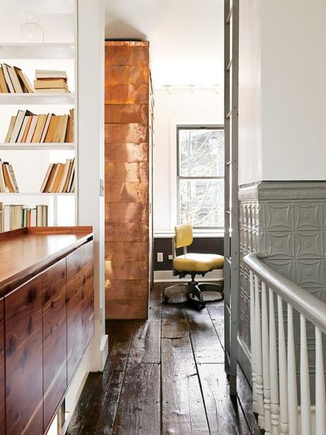 Modern home office with copper-covered walls 