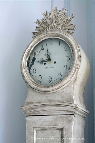 a distressed and antiqued Swedish Mora Clock
