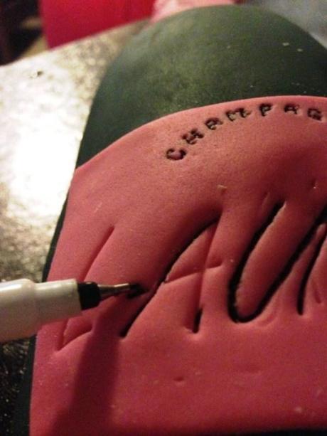 adding personalisation to champagne bottle pink label cake americolor black edible ink writer pen