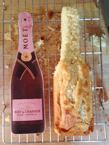 trimming madeira cake to make champagne bottle shape for celebration party wedding