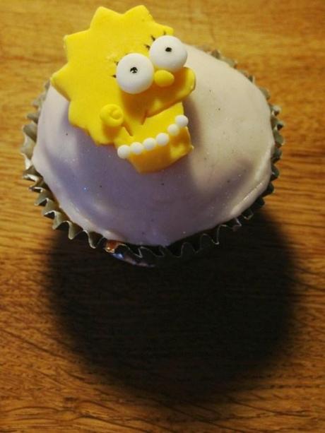 lisa simpson cupcake with pearls necklace black eyelashes painted on