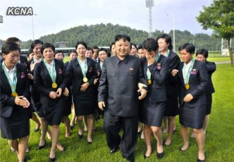 Kim Jong Un walks with DPRK women soccer players who won the East Asia Football Federation Cup (Photo: KCNA).