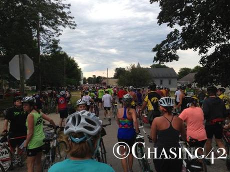 A sea of riders heading into Minburn, IA- looks like a nice excuse to slow down!