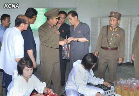 DPRK Premier Pak Pong Ju (2nd R) inspects products at a mushroom production site managed by the Korean People's Army (Photo: KCNA).