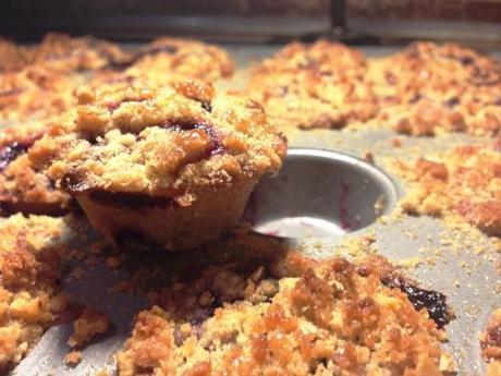 freshly baked mini blackcurrant muffins with caramelised oaty crumble topping