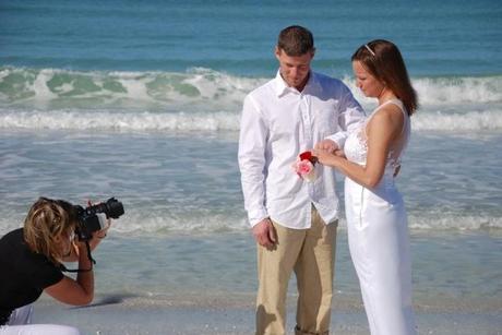 wedding photographer with bride and groom