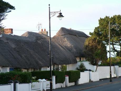 thatched roofs on homes at dunmore east in county waterford - ireland