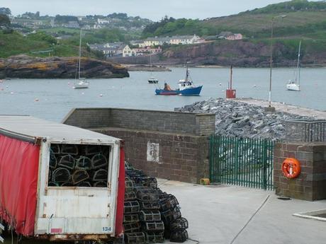 lobster traps sitting on main wharf at dunmore east in county waterford - ireland