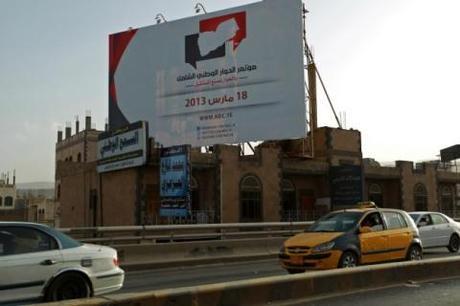 A billboard advertises Yemen's national dialog process. (Photo: FP)