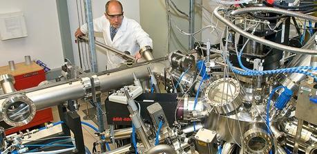 Brookhaven Lab physicist Ivan Bozovic with the molecular beam epitaxy system he uses to engineer atomically precise superconducting materials. (Credit: Brookhaven National Laboratory)