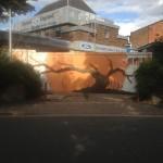 The Autumn Tree that wraps arpund the side and hidden amongst bushes - but hopefully creates a nice surprise for people as they walk into School Road.