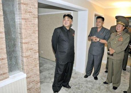 Kim Jong Un (L) tours apartment housing construction.  Also in attendance are Ma Won Chun (2nd L) and VMar Choe Ryong Hae (3rd L) (Photo: Rodong Sinmun).