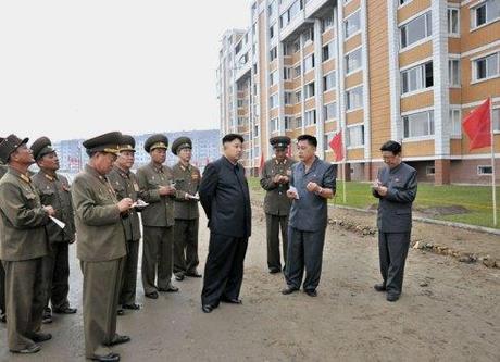 Kim Jong Un tours the construction of apartment housing for scientists.  Also seen in attendance are Hwang Pyong So (R) and Ma Won Chun (2nd R) (Photo: Rodong Sinmun).