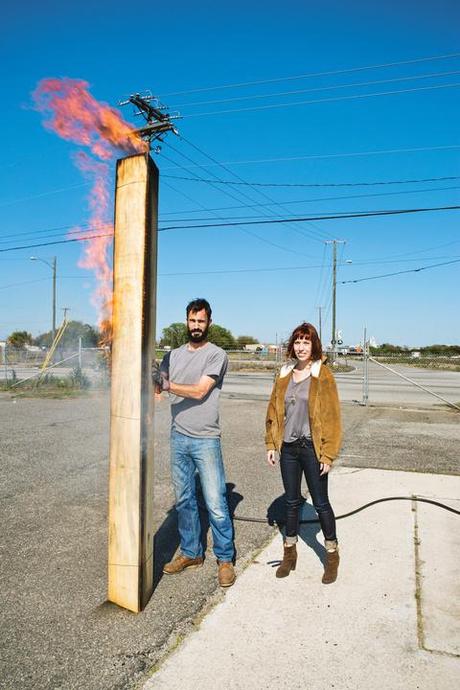 Furniture designers demonstrating Japanese wood burning technique.