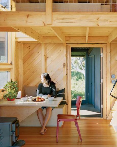 Pine clad dining room with built-in furniture