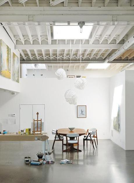 Dining area with vintage Danish dining set and Cloud pendants by Frank Gehry 