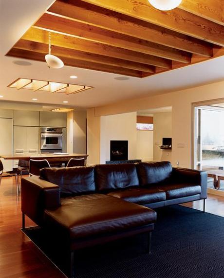 brown couch wood floors and ceiling wheelchair friendly home