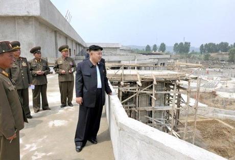 Kim Jong Un watches the progress of the construction of the outdoor pool and water amusements at Munsu Wading Pool in Pyongyang (Photo: Rodong Sinmun).