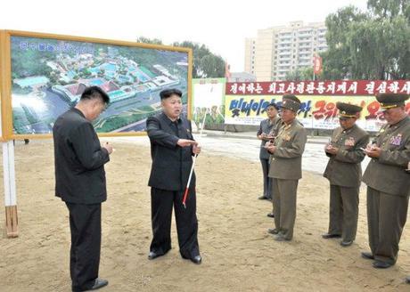 Kim Jong Un (2nd L) issues instructions about the construction of the Munsu Wading Pool in Pyongyang.  Also seen in attendance is architect and leading construction manager, KWP Department Deputy Director Ma Won Chun (L) (Photo: Rodong Sinmun).