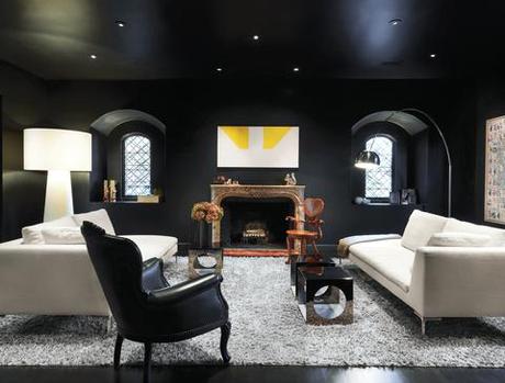 Modern living room with black walls and light furniture