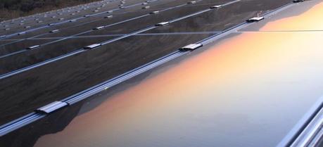 A view of the sunset reflecting in a solar panel. (Credit: Flickr @ Thomas Galvez http://www.flickr.com/photos/togawanderings/)