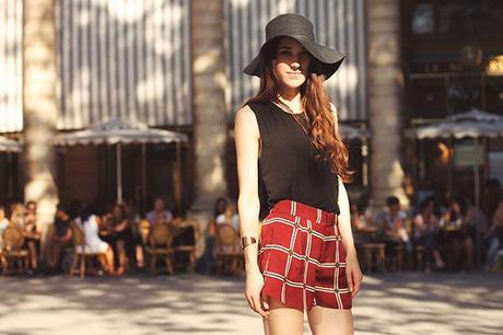 plaid shorts look with floppy hat and black top