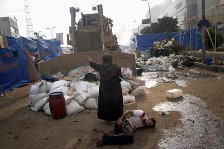Egyptian Woman Stands In Front Of Bulldozer To Protect Wounded Man As Egypt Explodes In Violence (Stunning Videos & Photos)