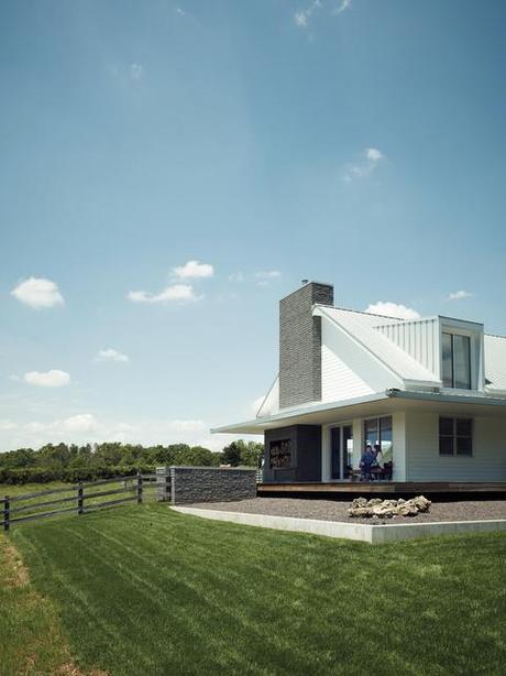 Extended outdoor view of modern house with wraparound porch