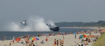 Russian Military Ship Plows Onto Crowded Beach (Video)
