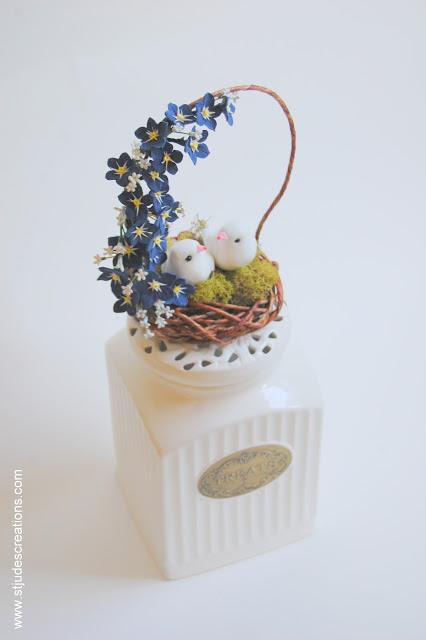 navy blue birds nest cake topper and navy blue paper anemone