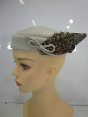 Vintage Hat Designers Lilly Dache' and Marion Valle'  agree - EYE MAKE-UP IS AS NECESSARY TO CHIC AS THE SMARTEST HAT.