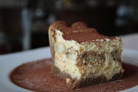 A serving of tiramisu dusted with cacao